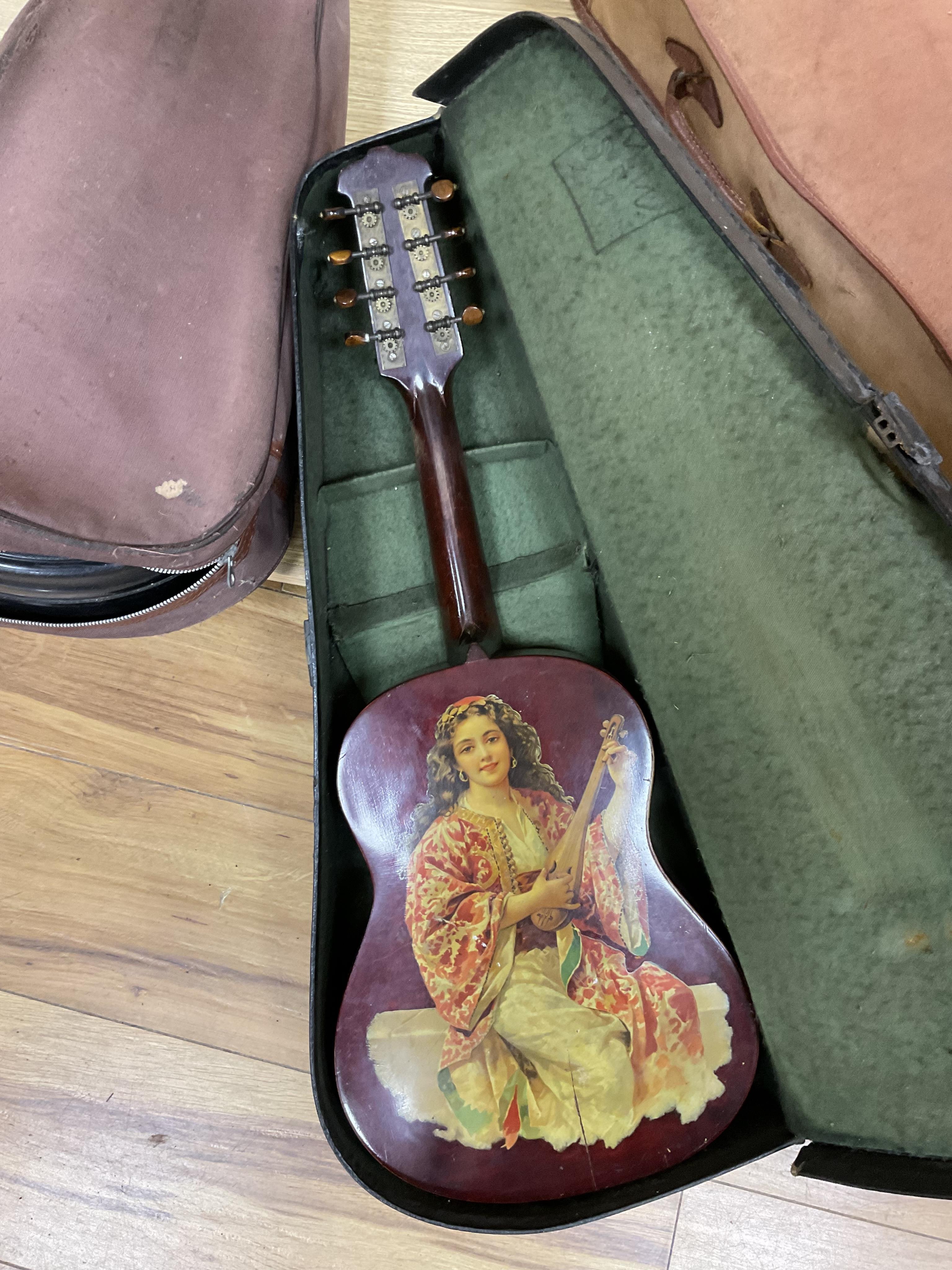 A quantity of violin parts and violins, a ukelele, a double bass scroll, a pinfold metronome, a violin case by Hill, a viola etc. Condition - for restoration